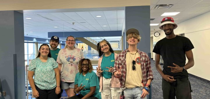 Seven Phi Theta Kappans posing for a photograph.